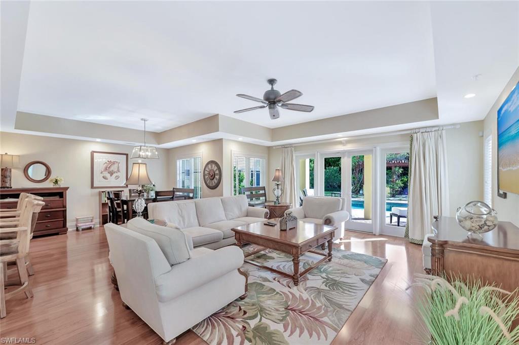 325 3rd Street South, Unit 6 Naples, FL 34102 - Photo 5 of 36 a living room with furniture and wooden floor