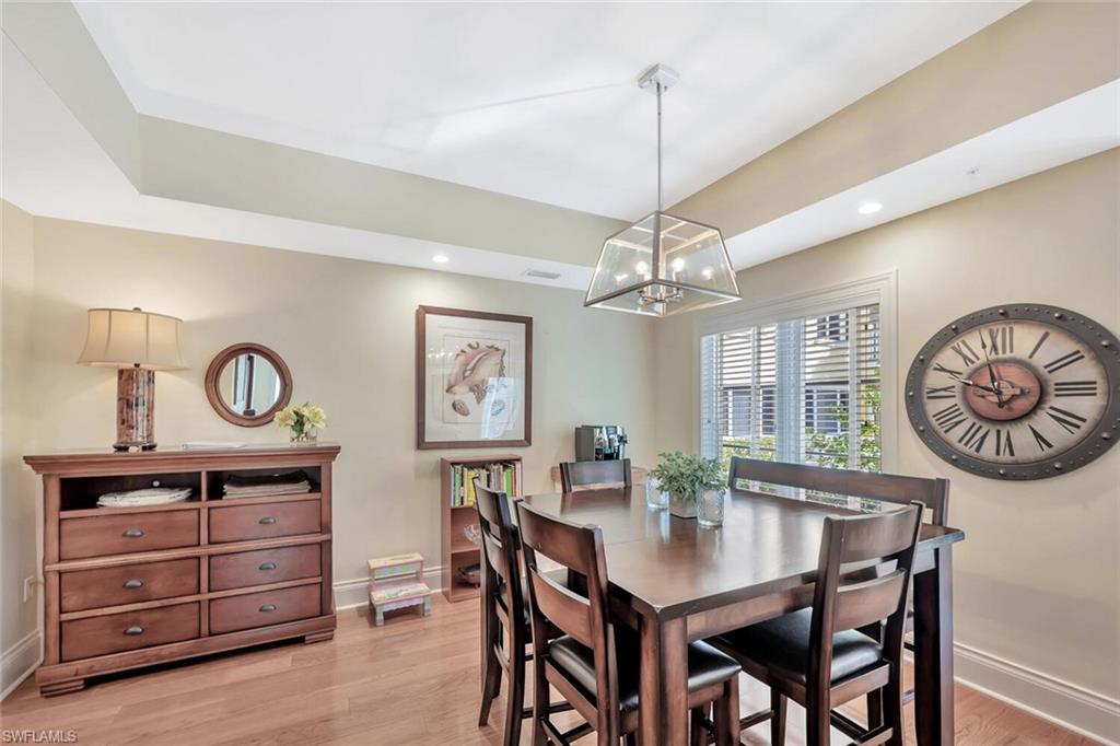 325 3rd Street South, Unit 6 Naples, FL 34102 - Photo 8 of 36 a view of a dining room and a table and chairs