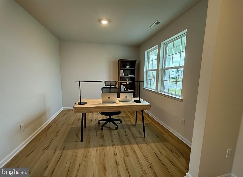 212 Daytona Road Egg Harbor Township, NJ 08234 - Photo 7 of 14 a view of a workspace with wooden floor