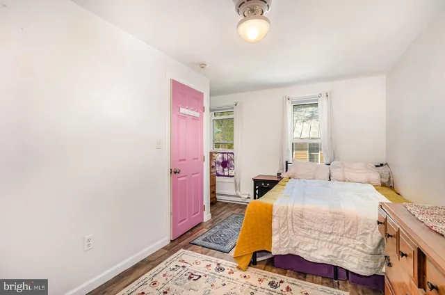 a bed room with a bed and a window