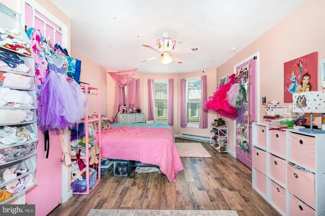a bedroom with furniture and a chandelier
