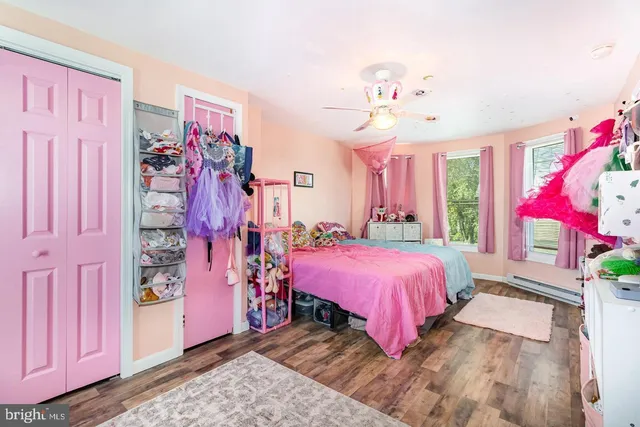 a bed room with a bed and a mirror