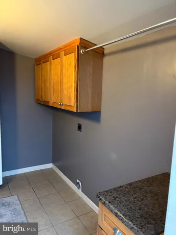 a bathroom with a sink and a window