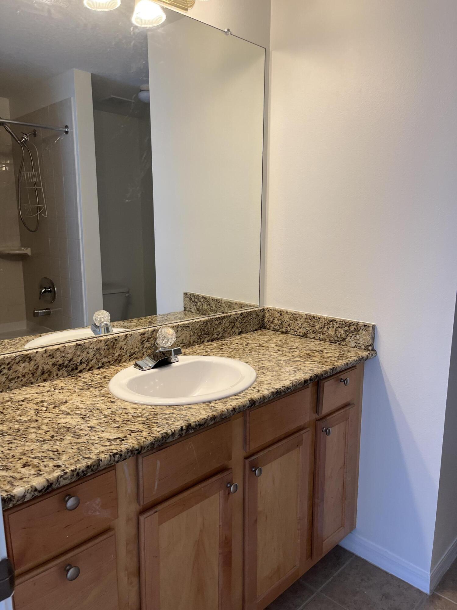 1621 Southeast Pomeroy Street, Unit 56 Stuart, FL 34997 - Photo 7 of 8 Guest bathroom