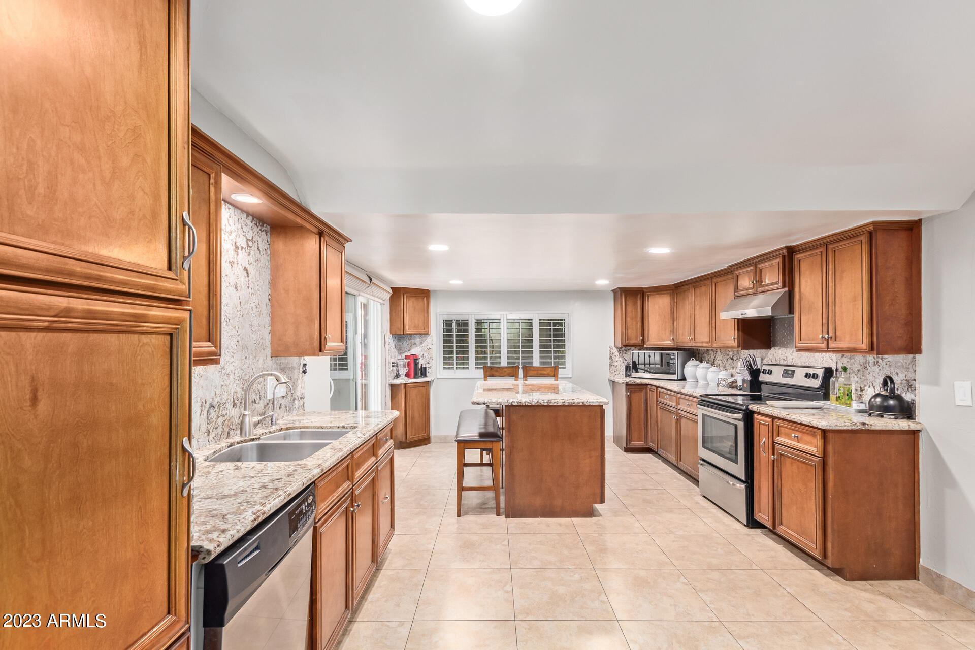 3834 North 34th Street Phoenix, AZ 85018 - Photo 12 of 29 a large kitchen with granite countertop lots of counter top space