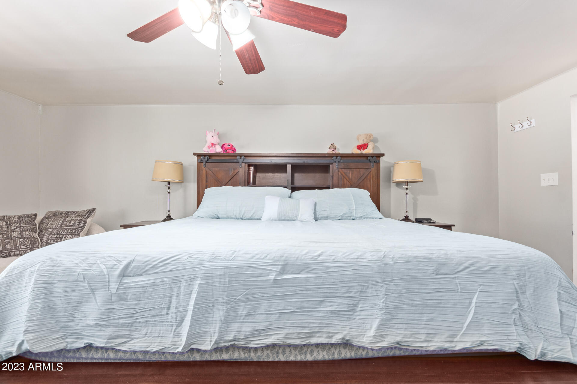 3834 North 34th Street Phoenix, AZ 85018 - Photo 13 of 29 a bedroom with a bed and a chandelier