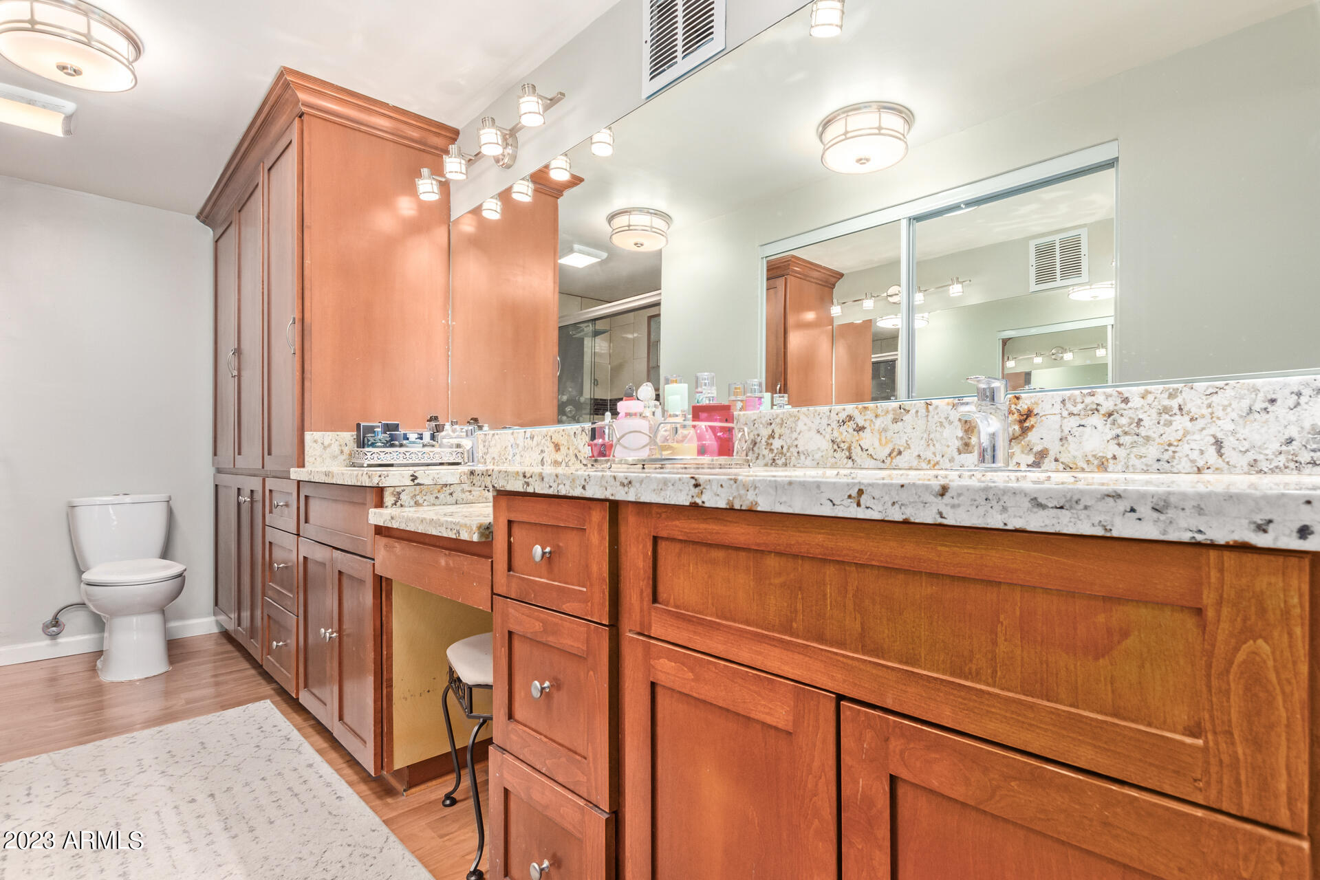 3834 North 34th Street Phoenix, AZ 85018 - Photo 15 of 29 a bathroom with a sink a vanity and a large mirror