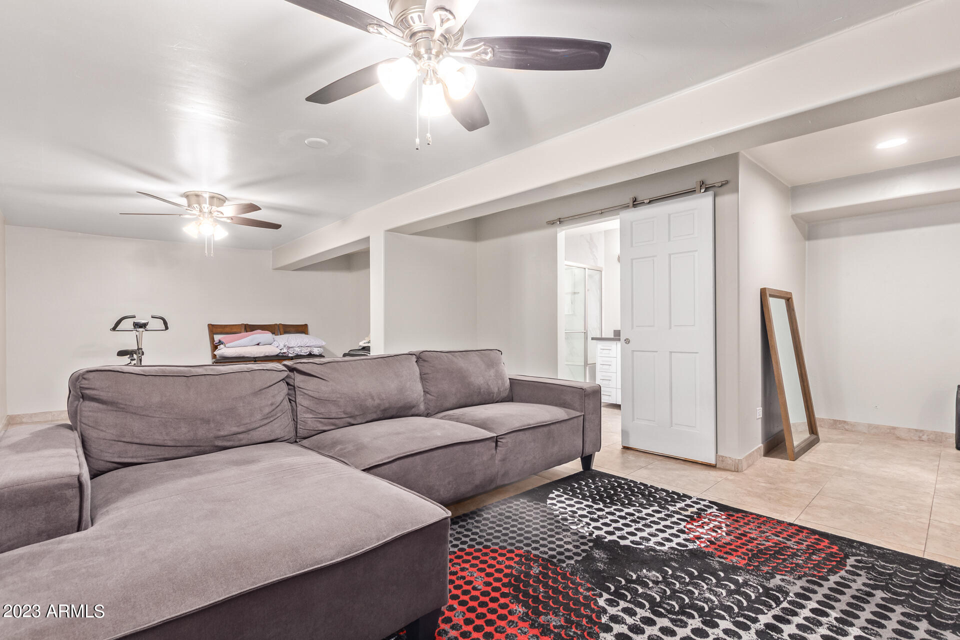 3834 North 34th Street Phoenix, AZ 85018 - Photo 18 of 29 a living room with furniture and a rug