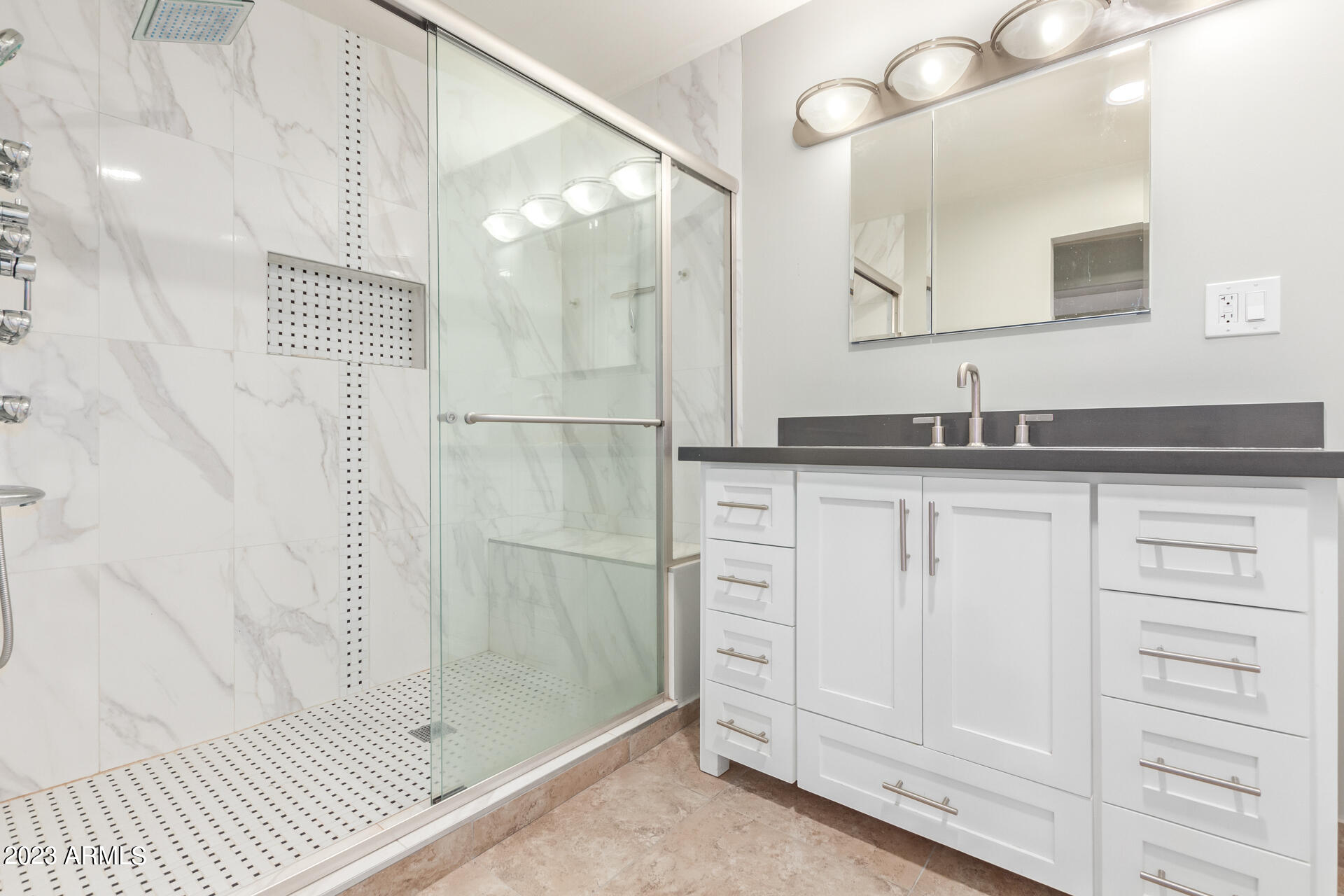 3834 North 34th Street Phoenix, AZ 85018 - Photo 20 of 29 a bathroom with a granite countertop sink a mirror and a shower