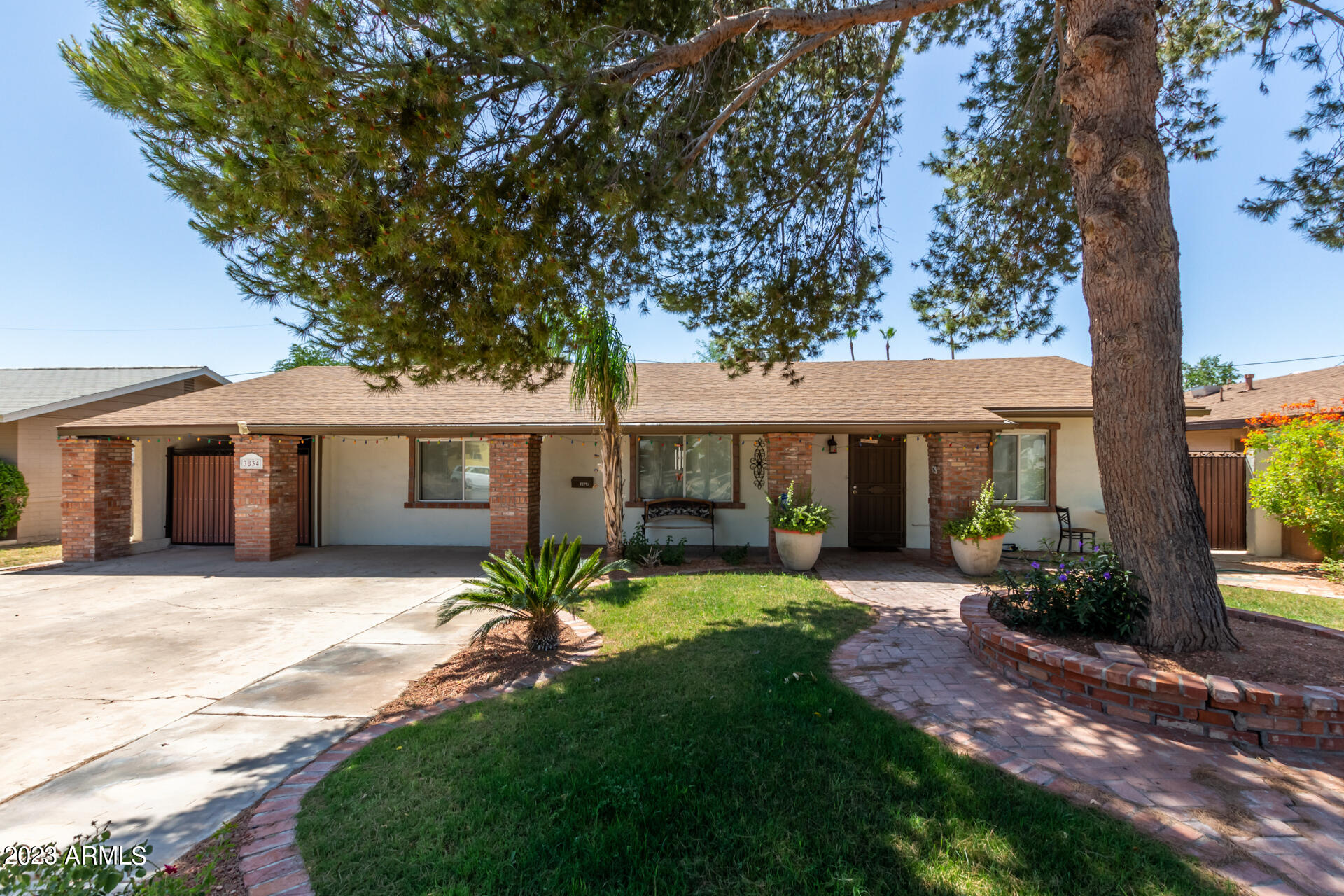 3834 North 34th Street Phoenix, AZ 85018 - Photo 2 of 29 a front view of a house with a garden