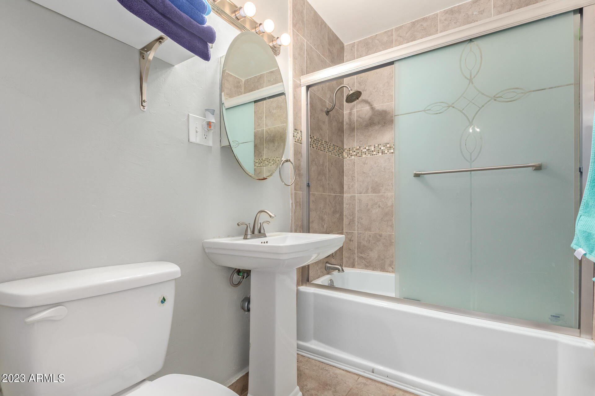 3834 North 34th Street Phoenix, AZ 85018 - Photo 21 of 29 a bathroom with a sink mirror toilet and shower
