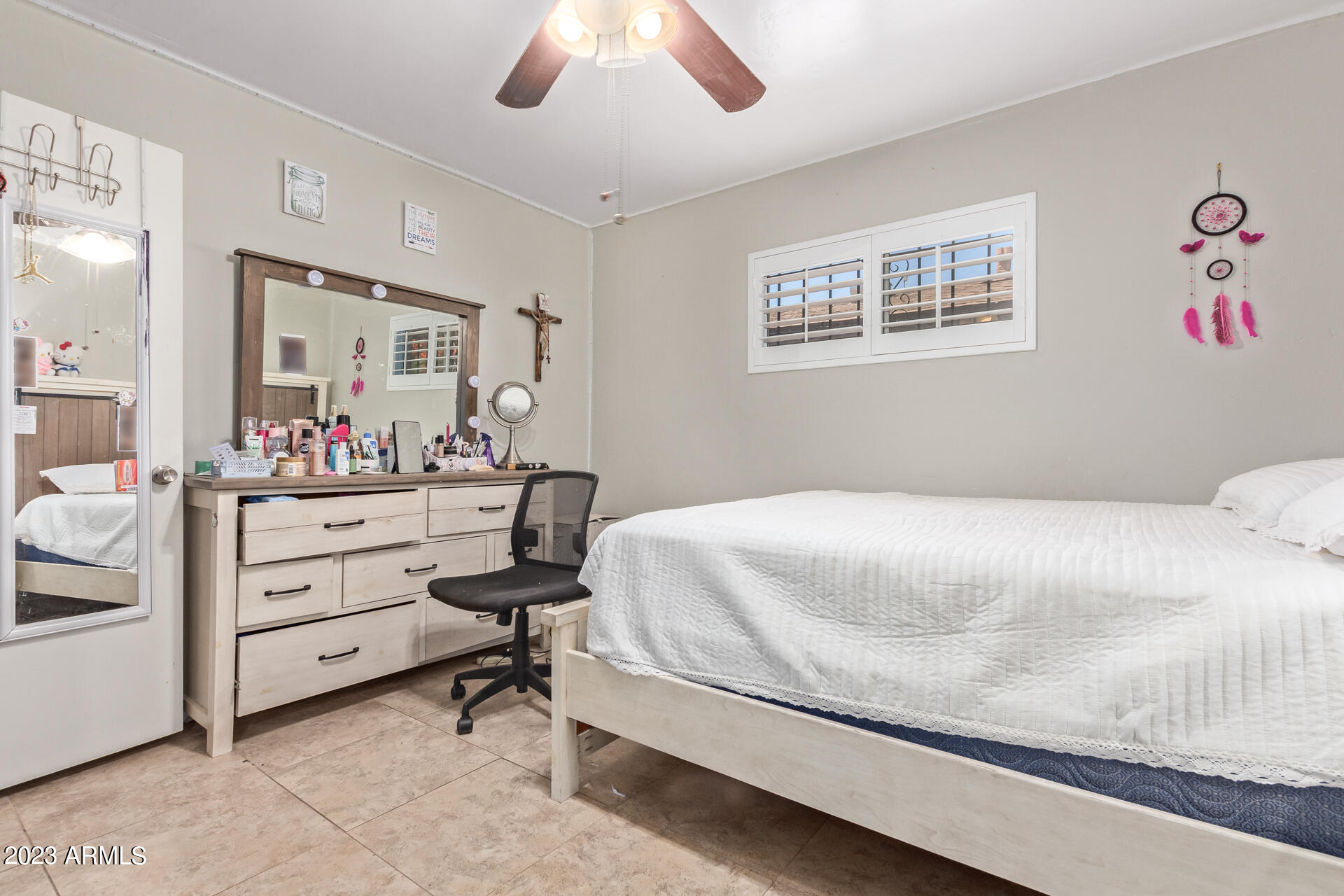 3834 North 34th Street Phoenix, AZ 85018 - Photo 22 of 29 a bedroom with a bed and a chandelier