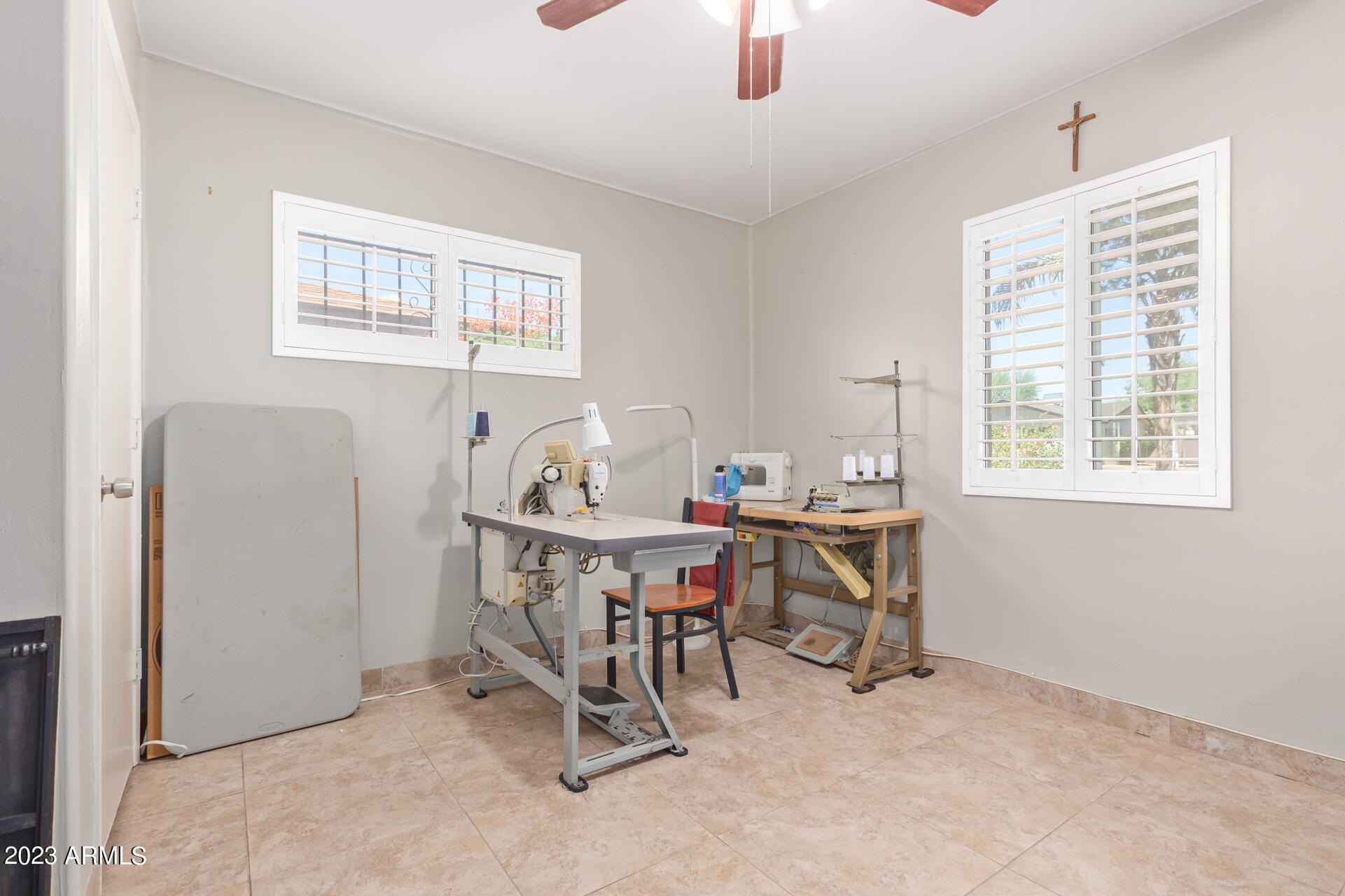 3834 North 34th Street Phoenix, AZ 85018 - Photo 23 of 29 a view of a workspace with furniture and a window