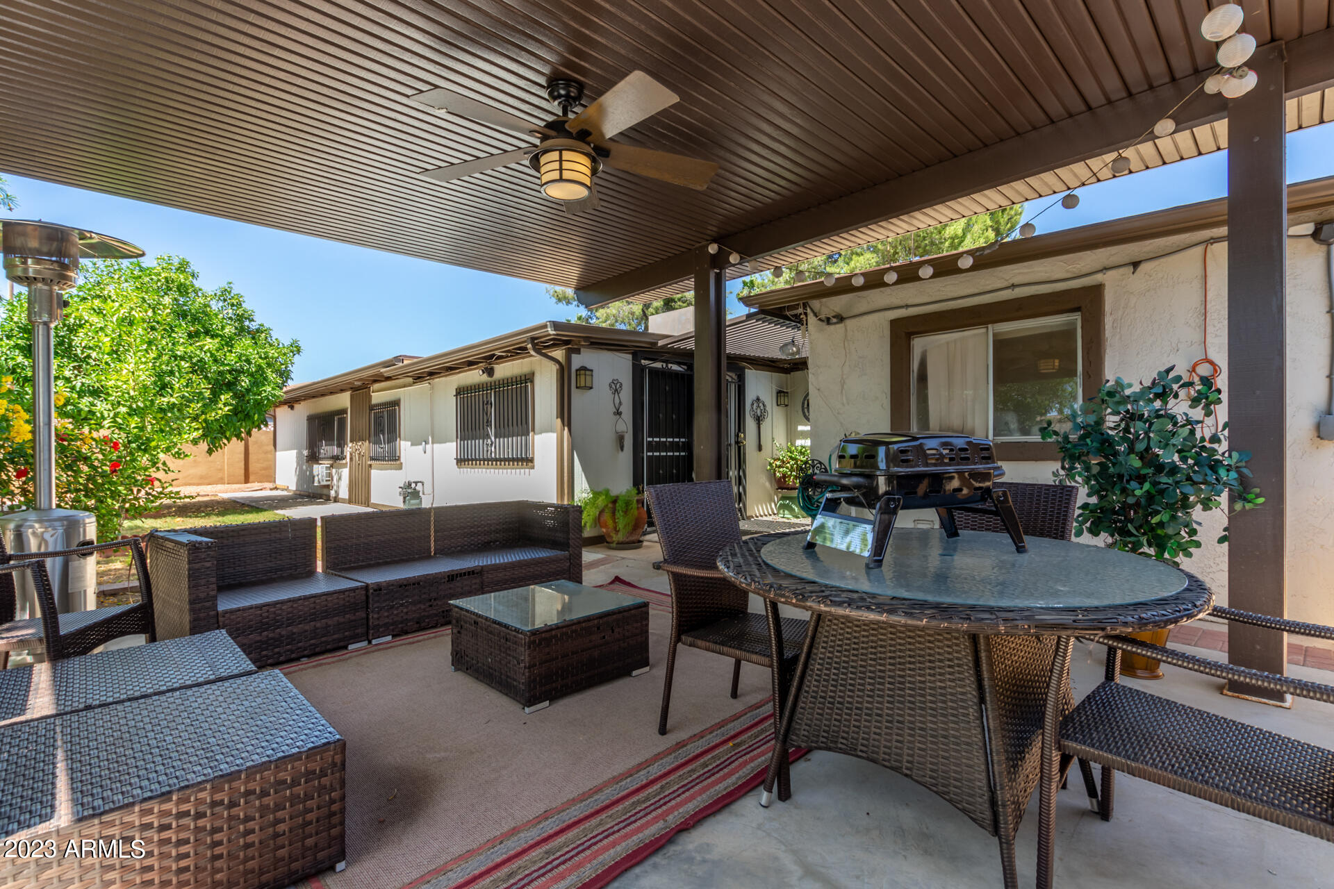 3834 North 34th Street Phoenix, AZ 85018 - Photo 27 of 29 a view of a patio with couches table and chairs and potted plants