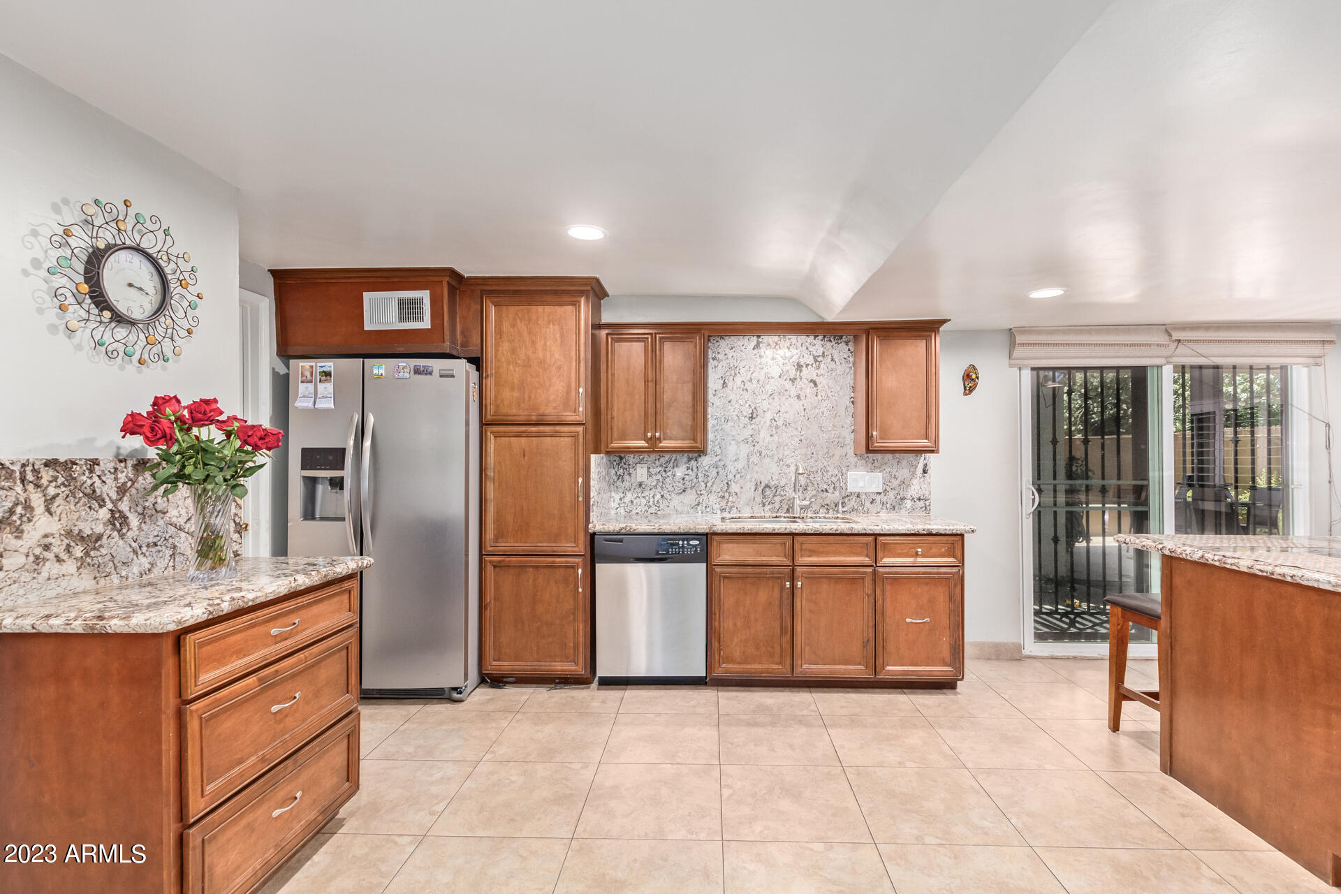 3834 North 34th Street Phoenix, AZ 85018 - Photo 9 of 29 a kitchen with stainless steel appliances granite countertop a refrigerator and a sink