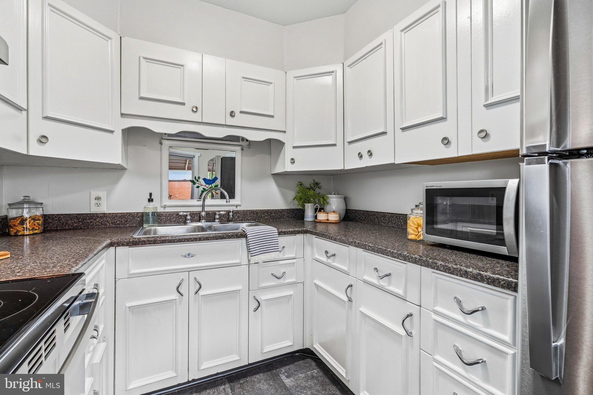 919 Seminole Road Frederick, MD 21701 - Photo 4 of 25 Kitchen with White Cabinetry
