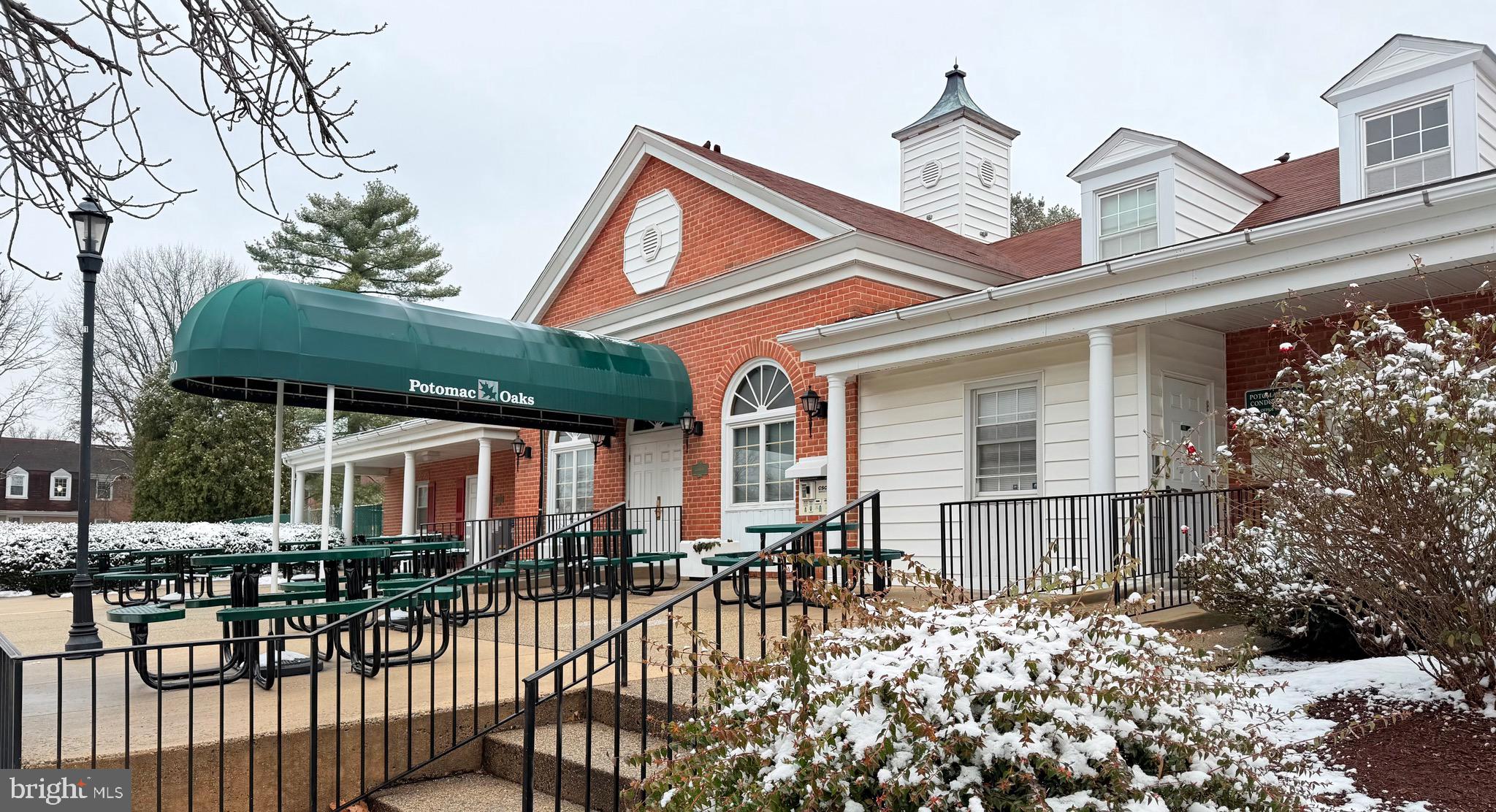 730 Quince Orchard Boulevard, Unit 730101 Gaithersburg, MD 20878 - Photo 31 of 47 a front view of a house with a porch