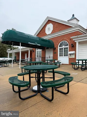 a living room with furniture a pool table and a clock
