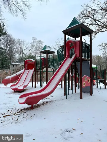 a backyard of a house with barbeque oven table and chairs