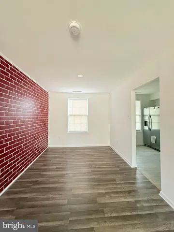 a view of a livingroom with wooden floor