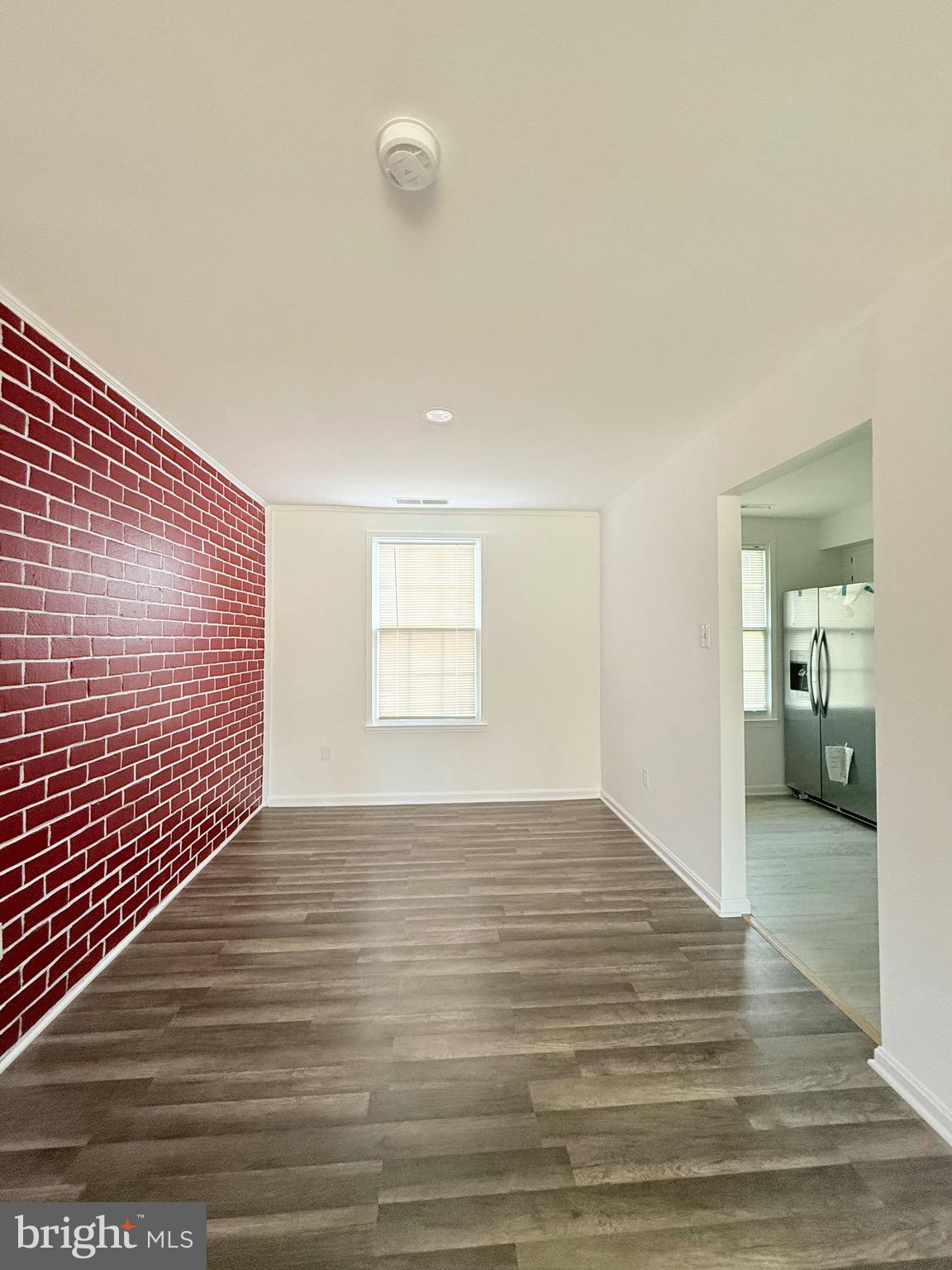 730 Quince Orchard Boulevard, Unit 730101 Gaithersburg, MD 20878 - Photo 4 of 47 a view of a livingroom with wooden floor