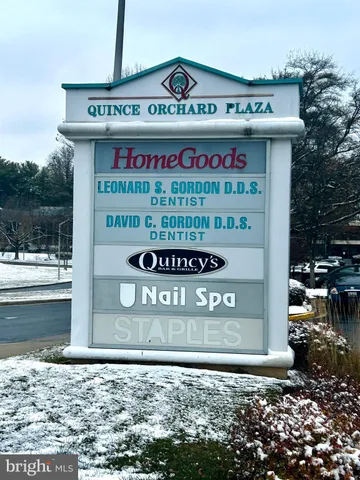 a sign that is on a brick wall