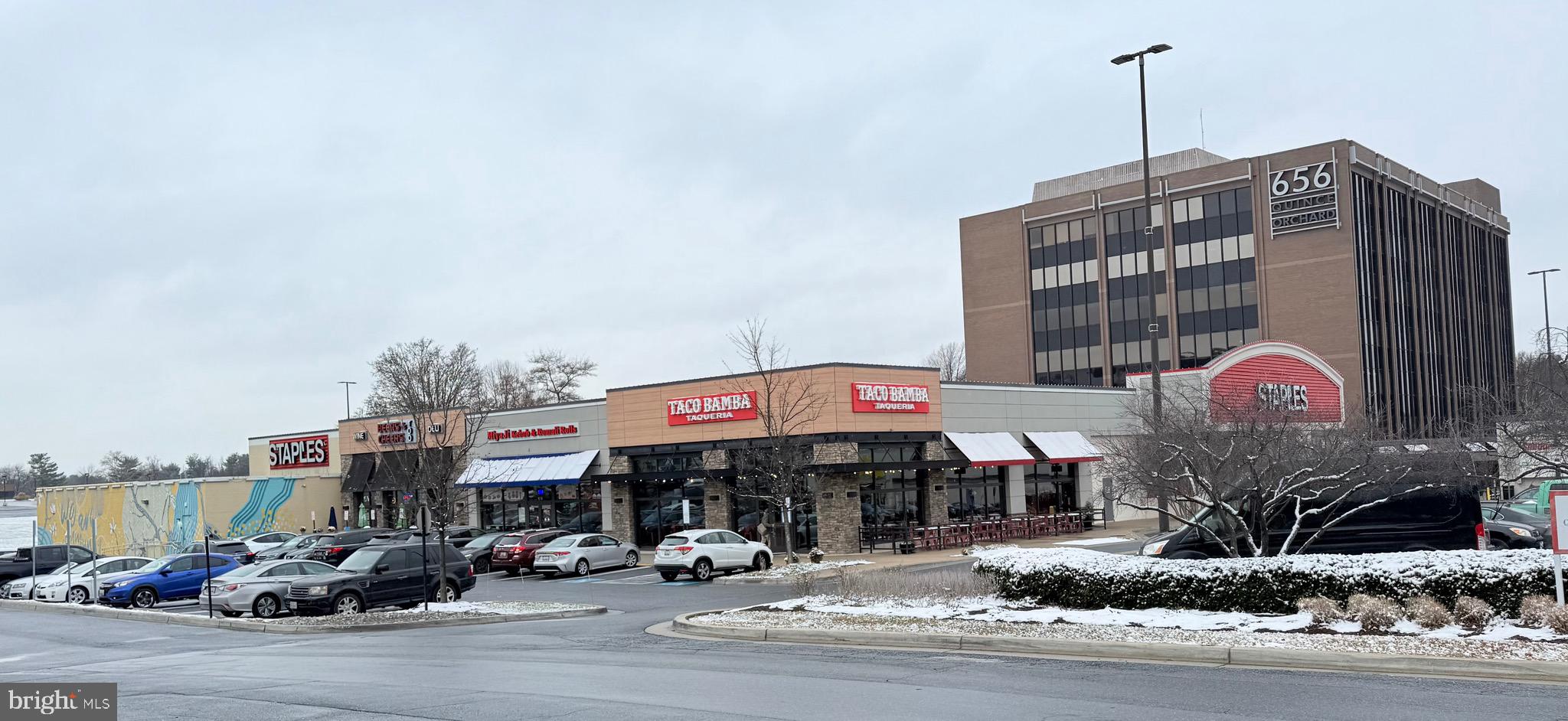 730 Quince Orchard Boulevard, Unit 730101 Gaithersburg, MD 20878 - Photo 46 of 47 a front view of a building with street