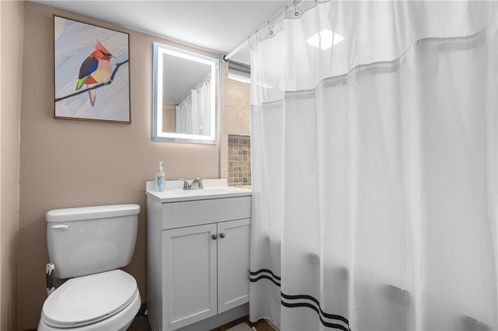 62 Allegheny Avenue Valencia, PA 16059 - Photo 16 of 30 a bathroom with a toilet a sink and a mirror