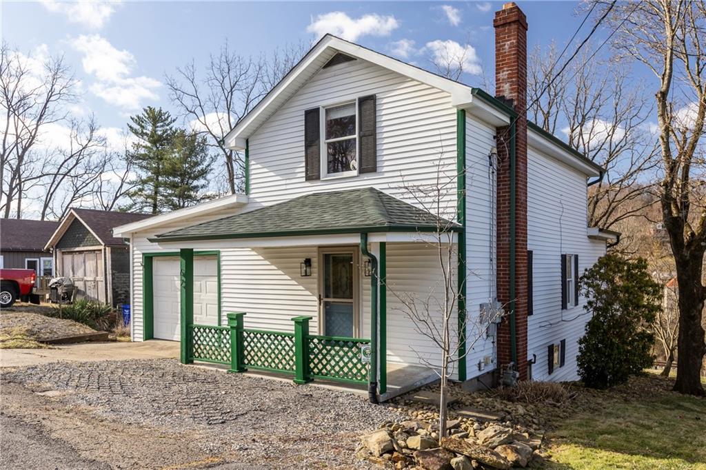 62 Allegheny Avenue Valencia, PA 16059 - Photo 2 of 30 a front view of a house with a garden and yard