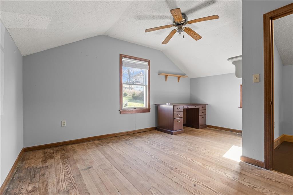 62 Allegheny Avenue Valencia, PA 16059 - Photo 22 of 30 a view of an empty room with a window and a kitchen