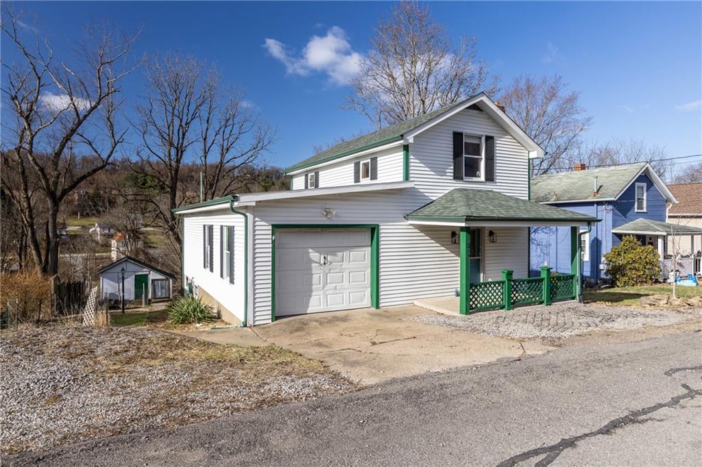 62 Allegheny Avenue Valencia, PA 16059 - Photo 3 of 30 a front view of a house with a yard and garage