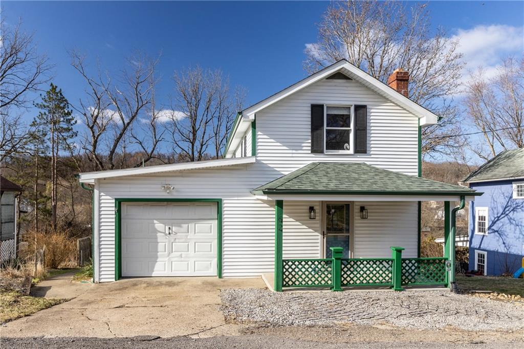 62 Allegheny Avenue Valencia, PA 16059 - Photo 4 of 30 a front view of a house with a yard and garage