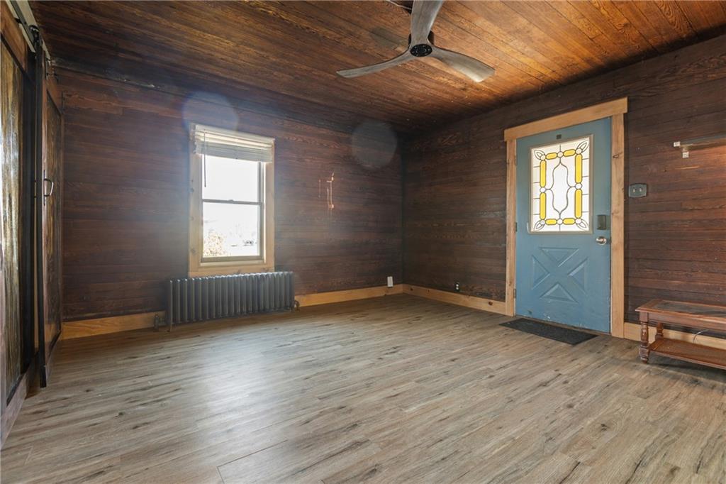 62 Allegheny Avenue Valencia, PA 16059 - Photo 5 of 30 an empty room with wooden floor and windows