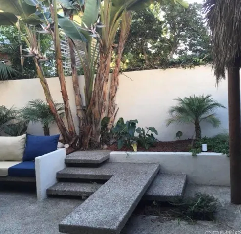 a view of a yard with an outdoor seating