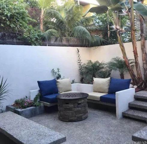 a view of outdoor sitting area with furniture