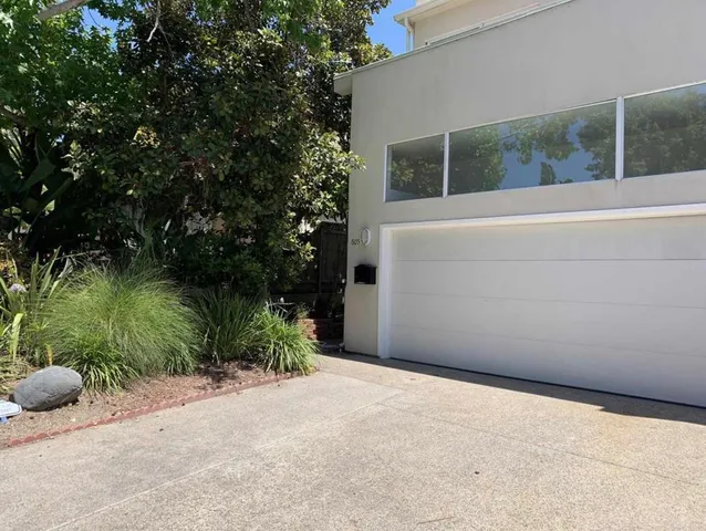 a backyard of a house with lots of green space