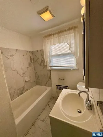 a bathroom with a sink and a bathtub