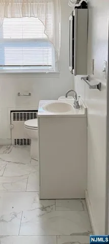 an empty room with windows and entrance