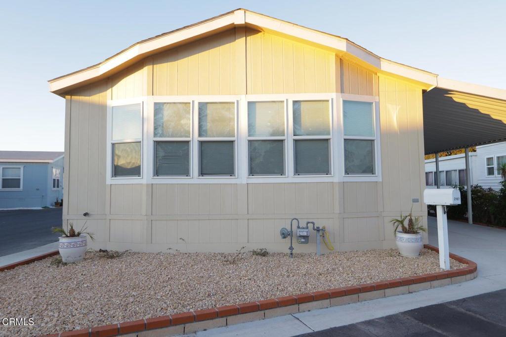 a bathroom with a granite countertop sink and a window