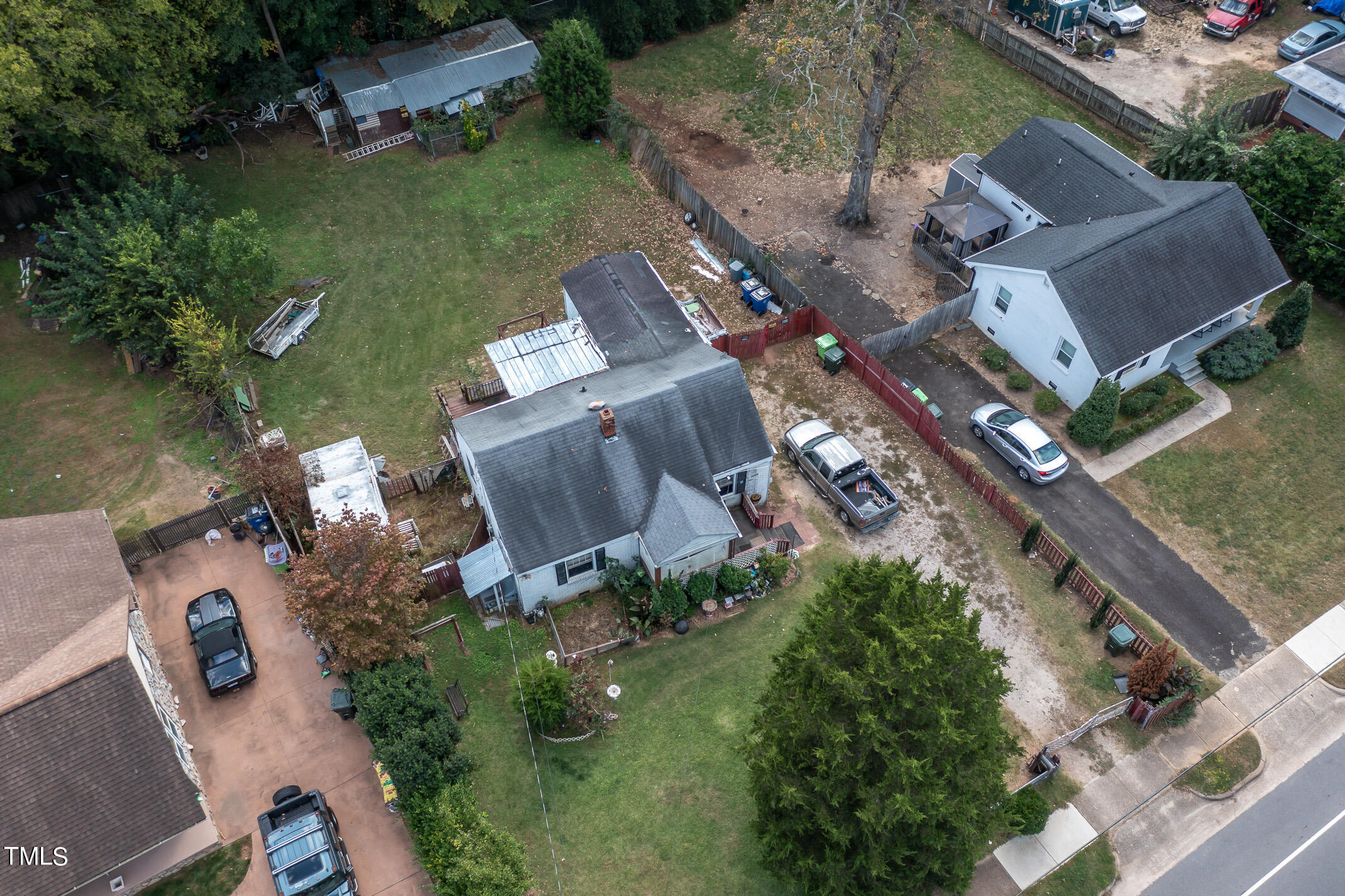 2214 Milburnie Road Raleigh, NC 27610 - Photo 13 of 14 an aerial view of a house with a garden and lake view