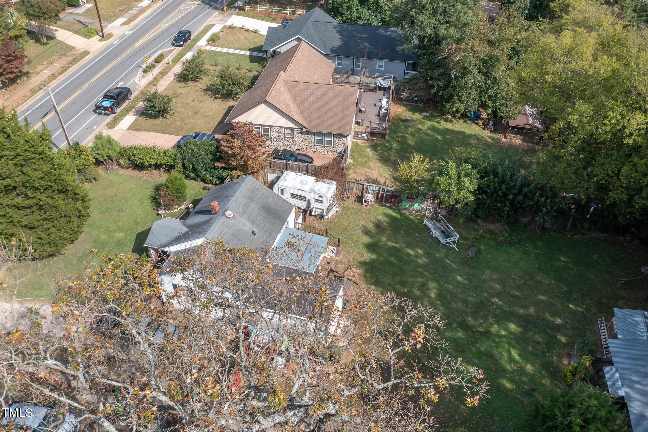 2214 Milburnie Road Raleigh, NC 27610 - Photo 4 of 14 an aerial view of residential house with outdoor space and trees all around