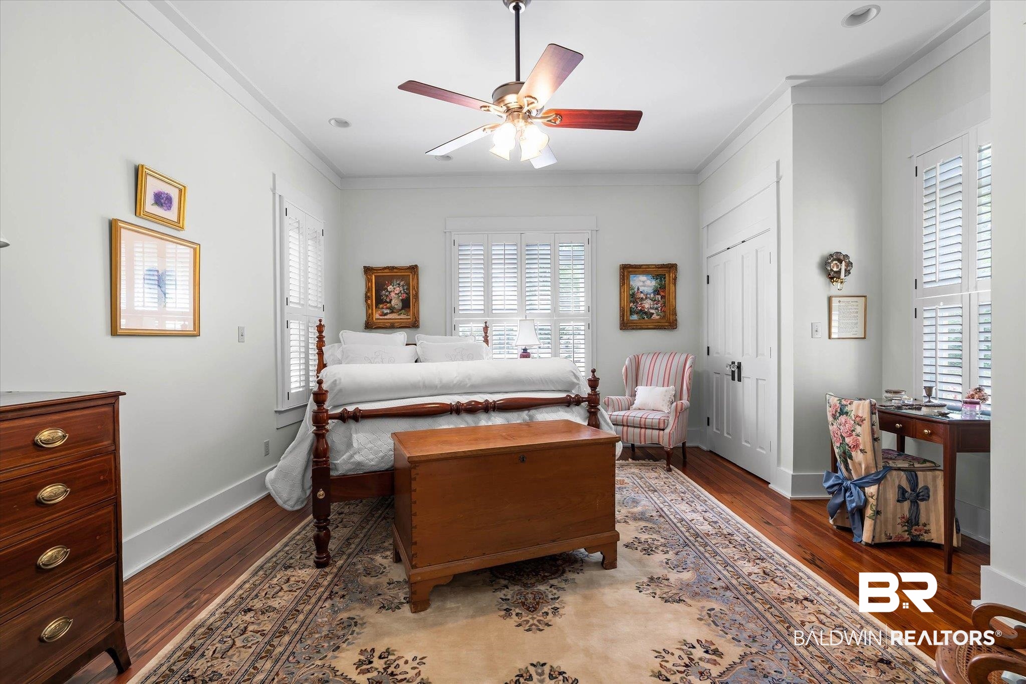 2300 Burgett Road Mobile, AL 36605 - Photo 18 of 40 Bedroom with crown molding, ceiling fan, dark wood-style floors, and a closet