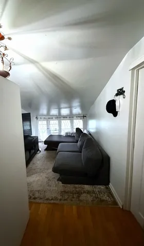 a kitchen with furniture and a window