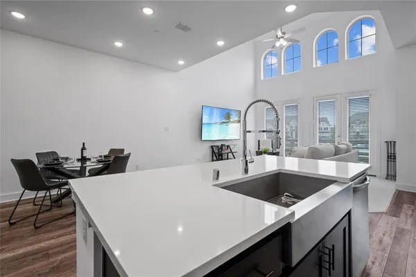 a kitchen with a table chairs and a stove