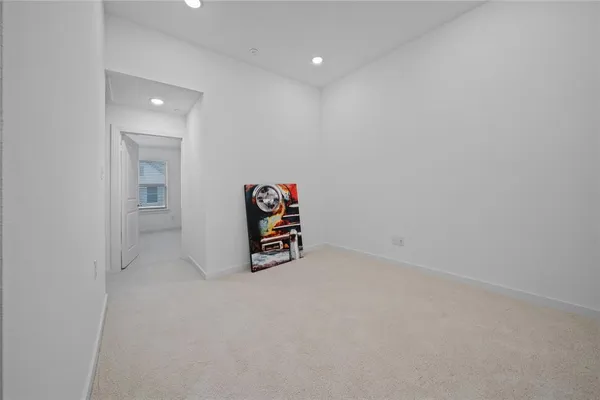 a view of a livingroom with an empty space and a window