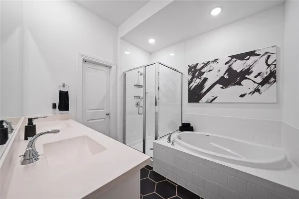 a bathroom with a bathtub and a sink