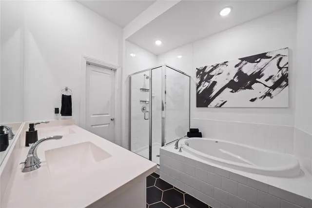 a bathroom with a bathtub and a sink