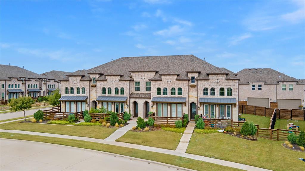 313 Sugar Maple Lane McKinney, TX 75071 - Photo 33 of 40 a front view of a residential apartment building with a yard