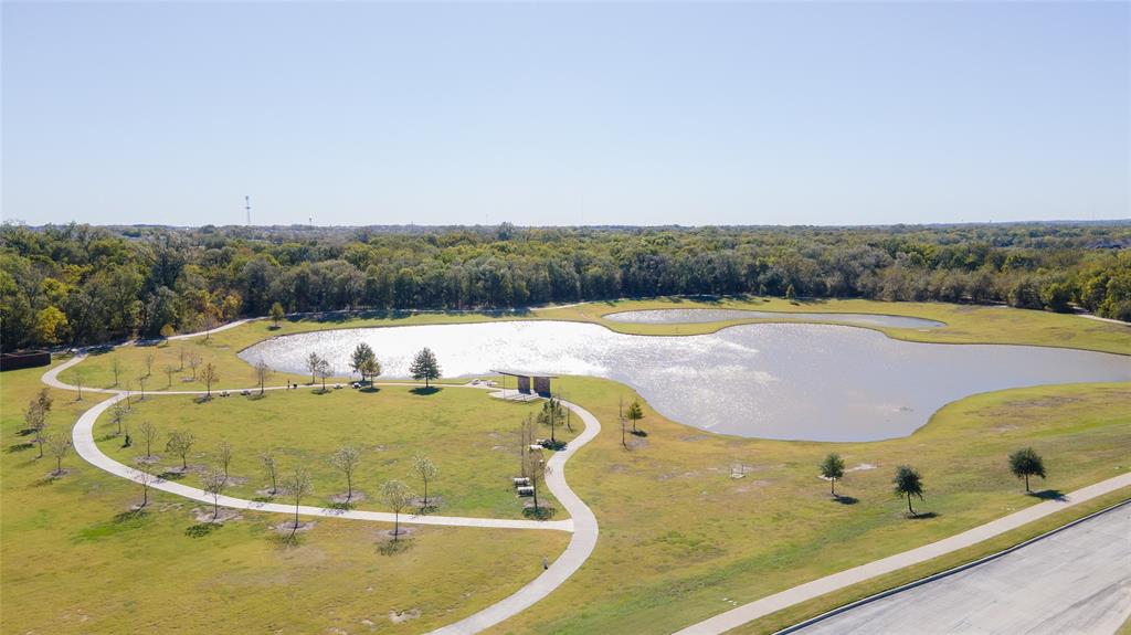 313 Sugar Maple Lane McKinney, TX 75071 - Photo 35 of 40 a view of a swimming pool and lake