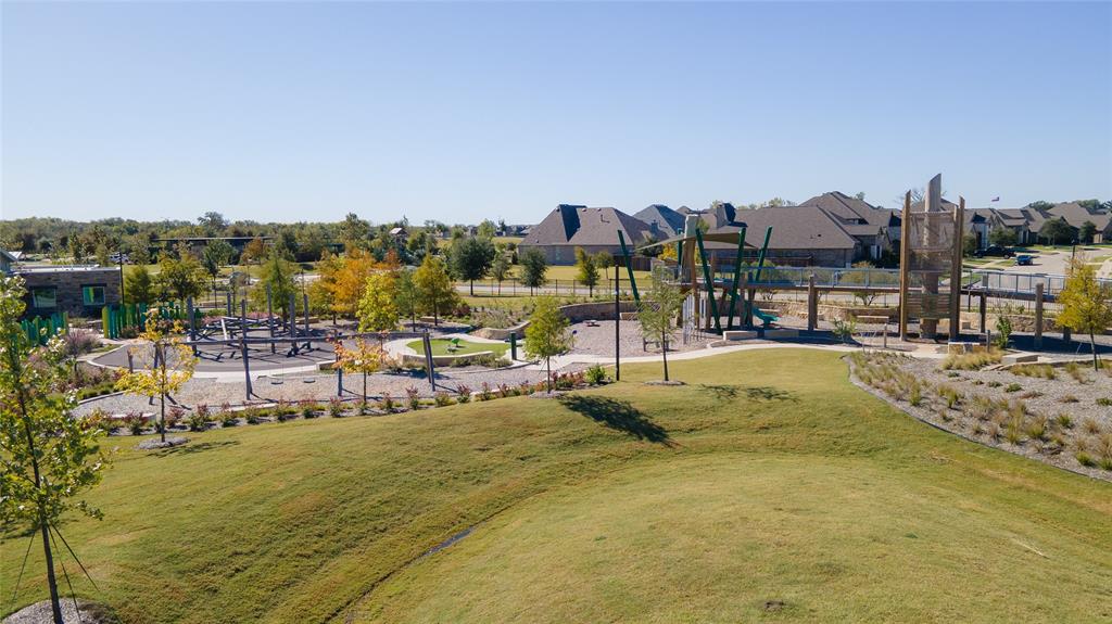 313 Sugar Maple Lane McKinney, TX 75071 - Photo 39 of 40 a view of a swimming pool with an ocean view